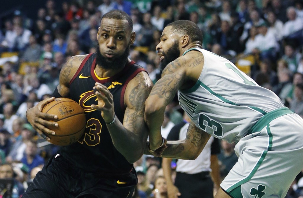In this February 11 photo, Cleveland's LeBron James (23) drives against Boston's Marcus Morris (13) during the third quarter of a game in Boston. They both took winding paths to get here, but the Cavaliers and Celtics are back in the Eastern Conference finals for the second straight season. James is looking to join an elite list of players to appear in eight consecutive NBA finals.