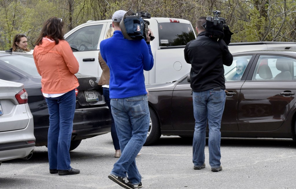 Waterville Mayor Nick Isgro backs his car away from reporters and would not answer questions following a press conference in Waterville on Monday.