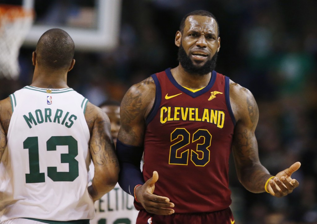 Cleveland Cavaliers forward LeBron James (23) reacts next to Boston Celtics forward Marcus Morris (13) during the third quarter of Game 1 of the Eastern Conference Finals on Sunday in Boston.
