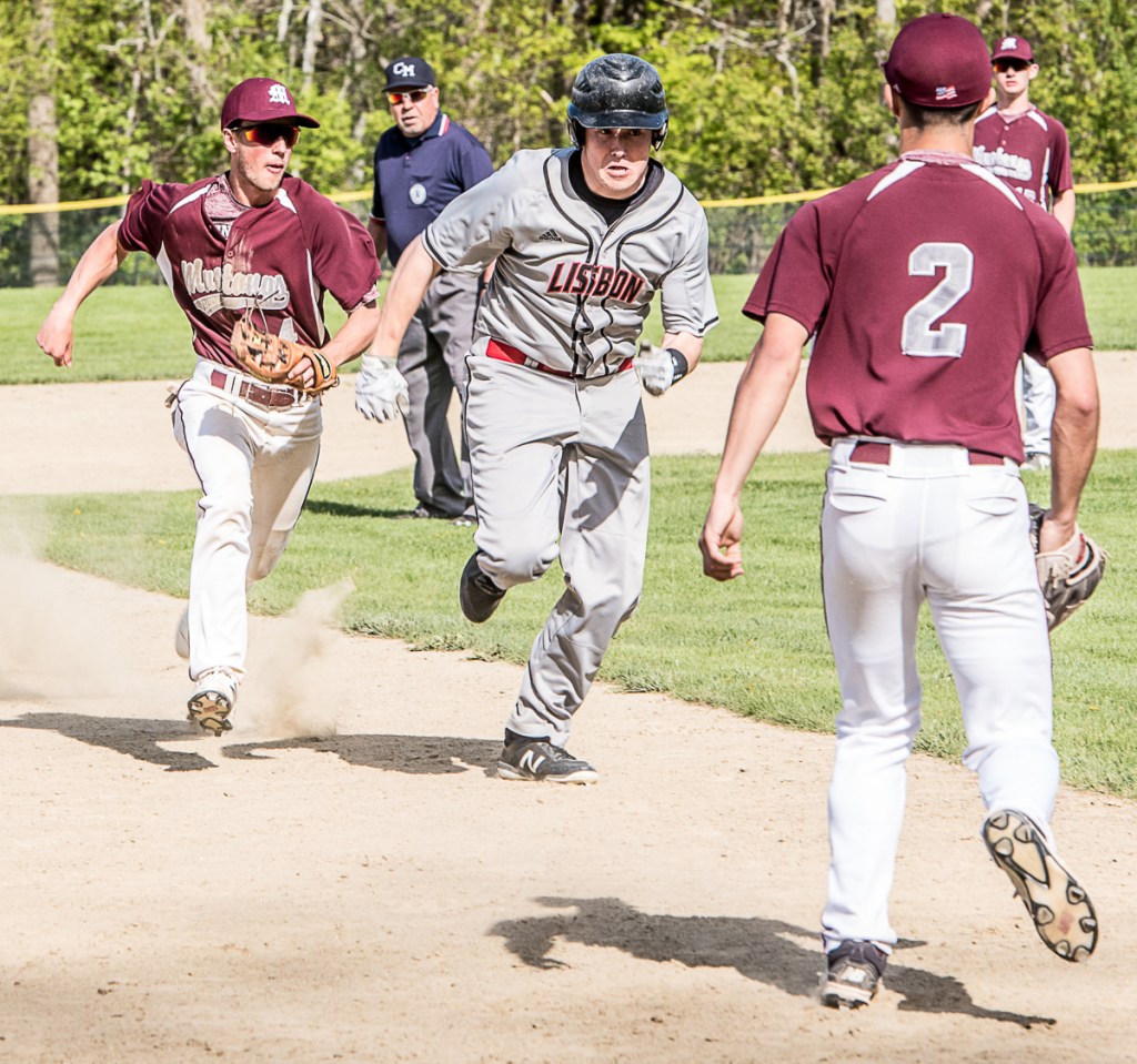 Lisbon baserunner Jonah Sautter is chased in a rundown by Monmouth infielder Nick Dovinski during a game Monday in Monmouth.