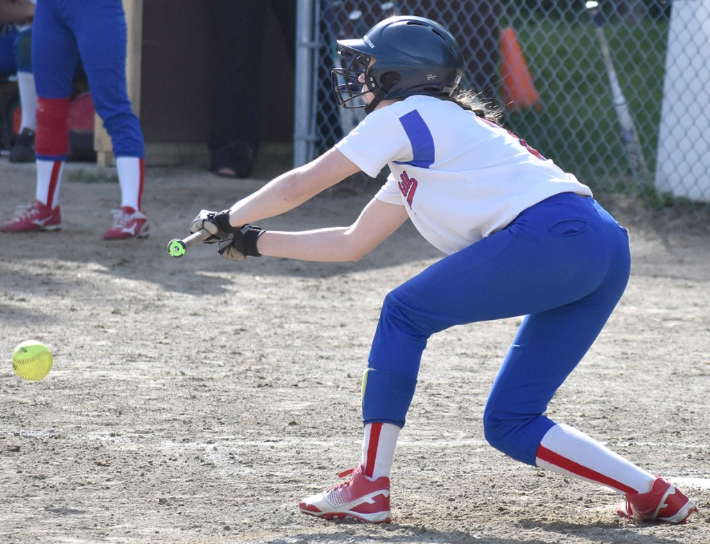 Oak Hill's Emily Ahlberg drops down a sacrifice bunt that scored a run in a win over Hall-Dale in Wales on Wednesday.