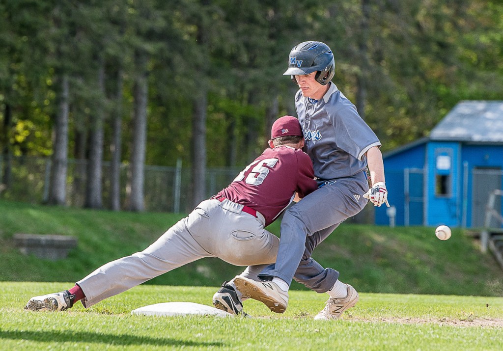 Monmouth first baseman Trevor Flanagan loses the ball as Mountain Valley's Dylan Desroches gets back to the base during a game Wednesday afternoon in Rumford.