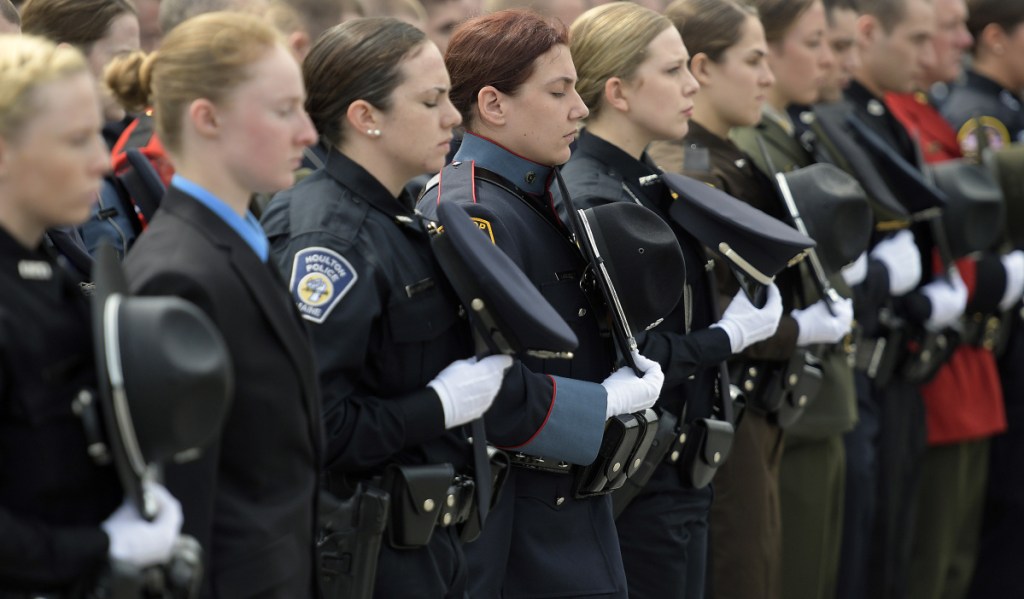 Law enforcement officers observe a moment of silence Thursday for Maine officers who died in the line of duty during the annual ceremony at the Maine Law Enforcement Officer's Memorial in Augusta.