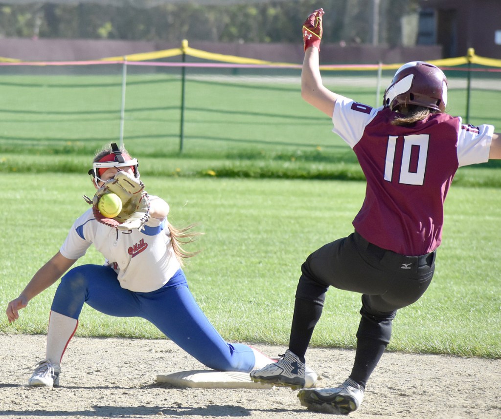 Oak Hill shortstop Kiera Young gloves a throw from first as Monmouth's Haylee Langlois comes sliding in during a Mountain Valley Conference game  Friday.