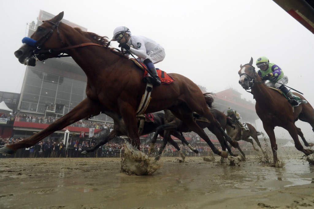 Justify with Mike Smith atop wins the the 143rd Preakness Stakes at Pimlico race course on Saturday in Baltimore.