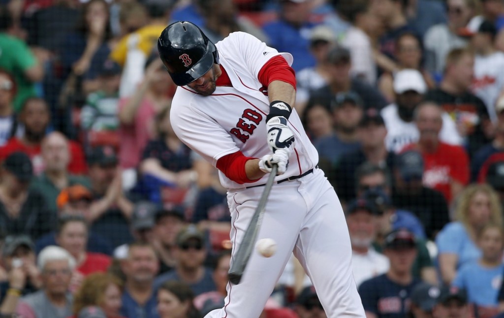 Boston's J.D. Martinez hits a two-run home run during the fifth inning Sunday against the Baltimore Orioles at Fenway Park in Boston.