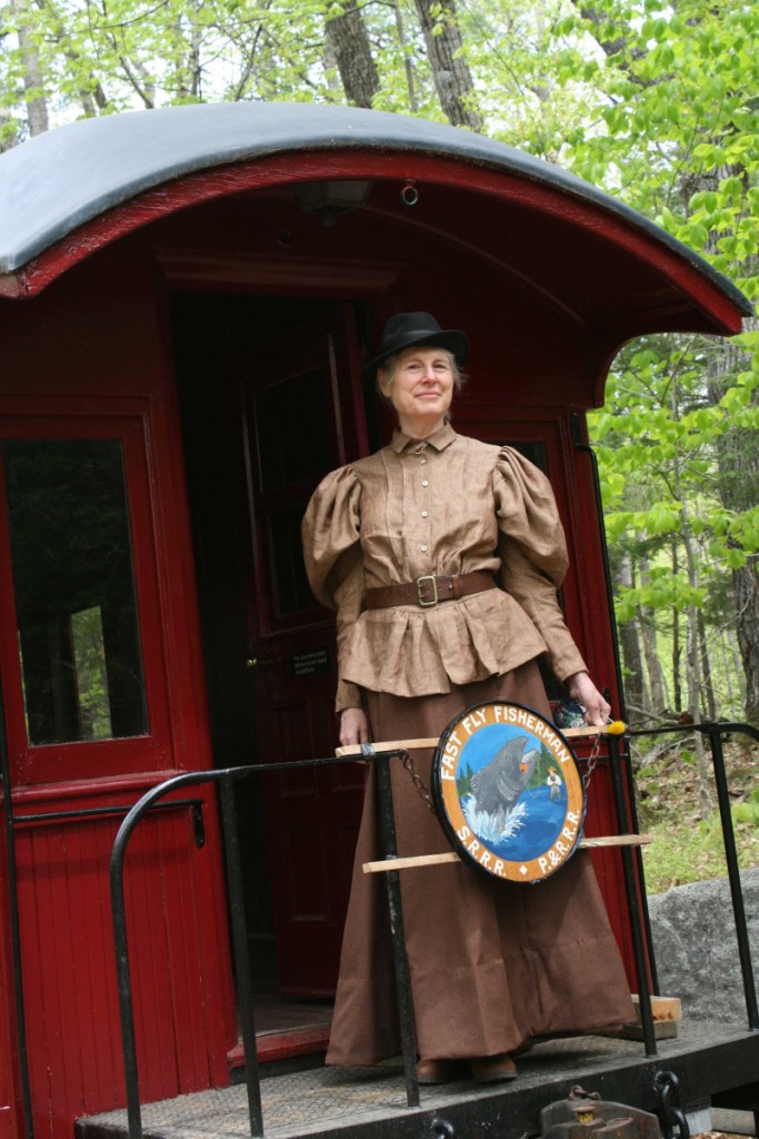 Cornelia "Fly Rod" Crosby, portrayed by Pam Matthews, of Phillips, rode with visitors Saturday morning at the Sandy River & Rangeley Lakes Railroad Museum to the roundhouse and back during the inaugural Fly Rod Crosby Days at Fox Carleton Pond Sporting Camps in Phillips.