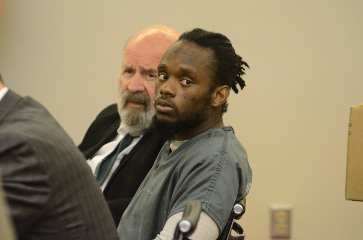 Aubrey Armstrong, right, listens in court Tuesday beside his translator, John Roy, as closing arguments were made at the Capital Judicial Center in Augusta. Armstrong has been using an interpreter to translate between English and Guyanese Creole.