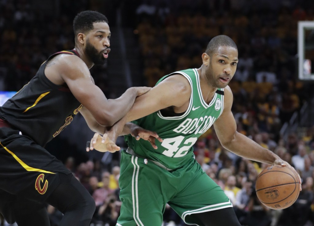 Boston Celtics forward Al Horford (42) drives on Cleveland's Tristan Thompson in the second half of Game 4 of the Eastern Conference finals on Monday in Cleveland.