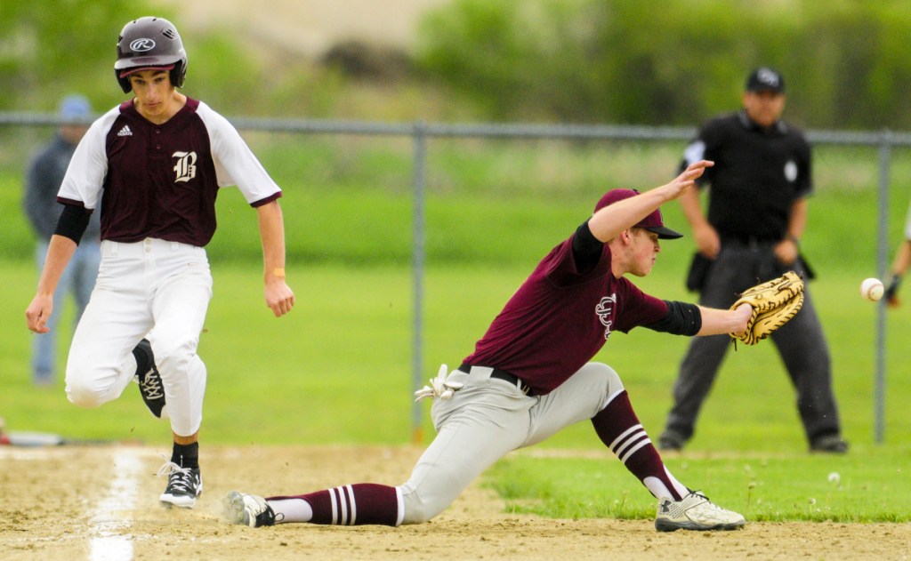 Buckfield's Shane St. Pierre, left, beats out the throw to first baseman Danny Stewart during a game on Tuesday on the Gerald N. Seigars Memorial Baseball Field in Richmond. The Bucks scored two runs on the play.