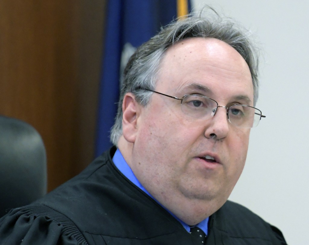 Justice Daniel Billings reads his verdict Wednesday convicting Aubrey N. Armstrong of Far Rockaway, New York, of felony murder and robbery in the Nov. 23, 2015, drug-related bludgeoning death of Joseph Marceau of Augusta.