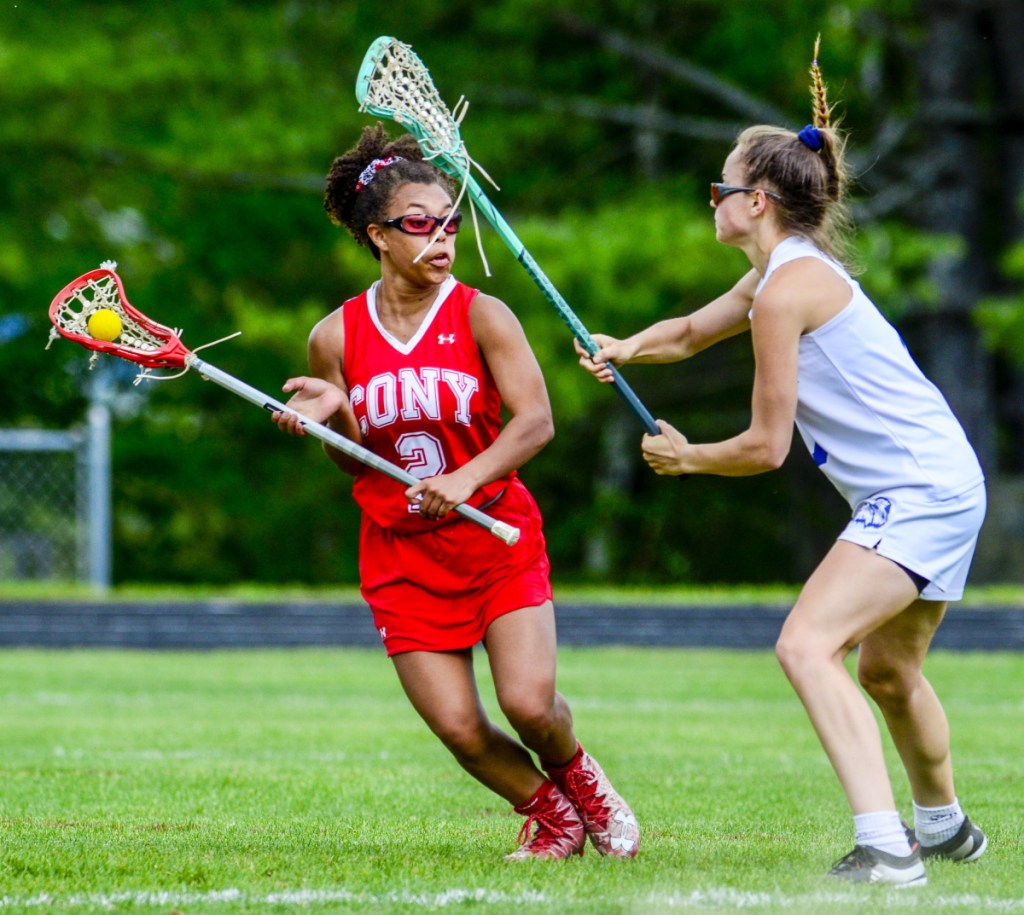 Cony's Kami Lambert, left, tries to get past Erskine Academy's Olivia Kunesh during a game Wednesday in South China.