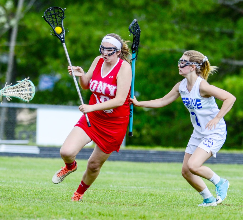 Cony's Abbigail Doiron, left, tries to get around Erskine Academy defender Tori Grasse during a game Wednesday in South China.