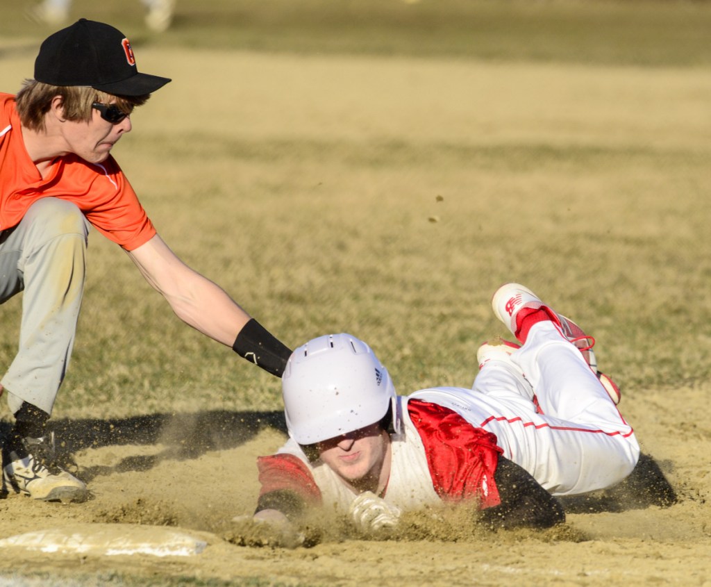 Gardiner first baseman Alic Shorey tags out Cony baserunner Mike Boivin before he can get back to the bag during a game earlier this season in Gardiner.