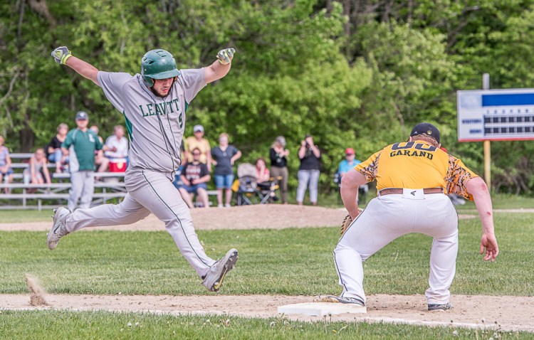 Maranacook's Dan Garand holds onto the ball and forces out a Leavitt baserunner during the baseball game in Turner on Friday afternoon.