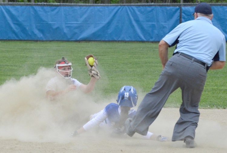 Oak Hill shortstop Kiera Young shows the ball in her glove to the umpire, who calls Madison runner Emily Edgerly out on a stolen base attempt during a Mountain Valley Conference game Friday in Wales.