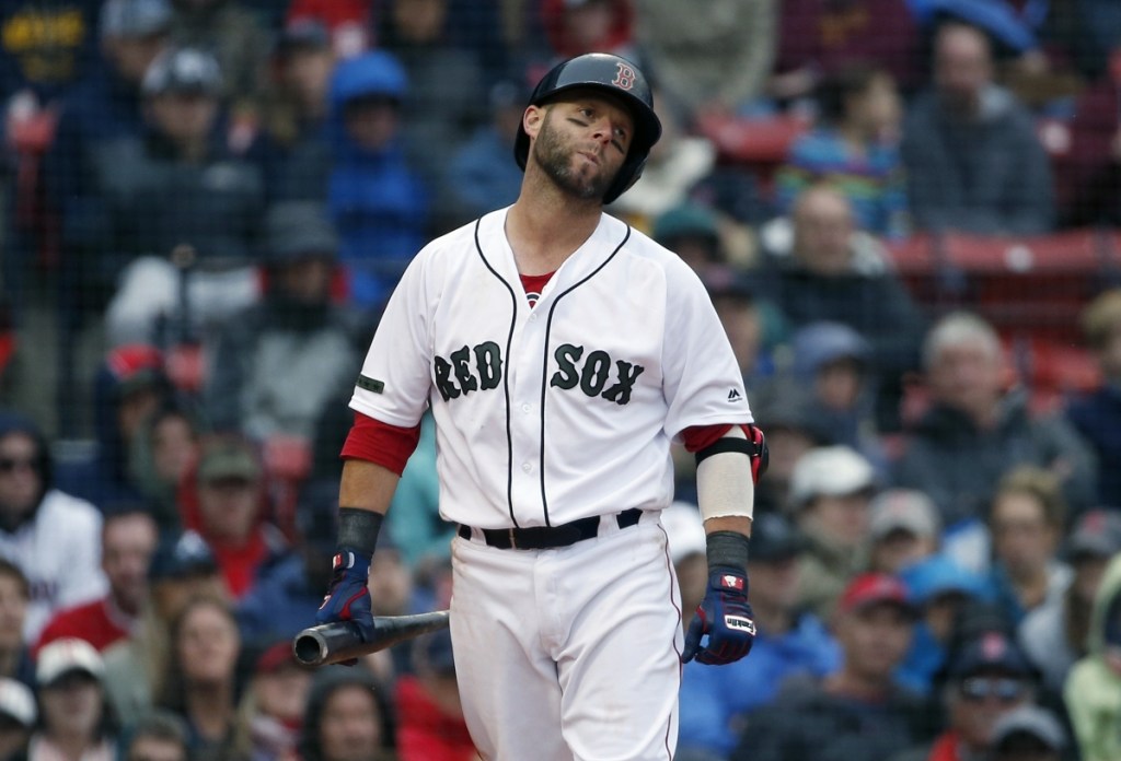 Boston's Dustin Pedroia reacts after being called out on strikes during the eighth inning against the Atlanta Braves on Sunday in Boston.