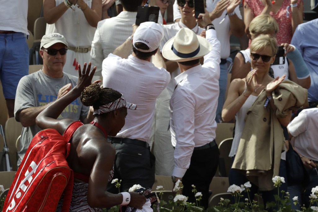 Venus Williams leaves the court after losing to Qiang Wang during their first round match of the French Open on Sunday at the Roland Garros Stadium in Paris.