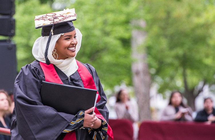 Rakiya Mohamed, from Auburn, smiles at the crowd after giving the senior address at the  Bates College graduation on Sunday morning.