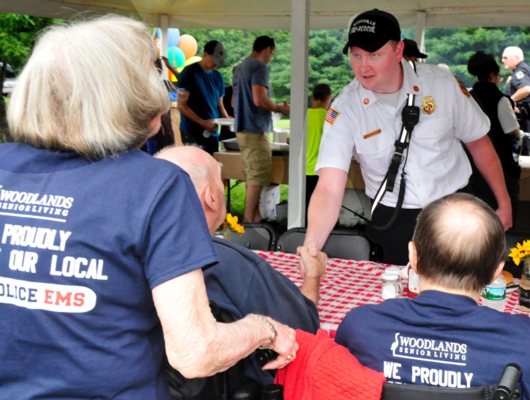 A Winslow committee has decided not to employ newly named Waterville Fire Chief Shawn Esler as the town's chief, according to a message Mike Roy received from Winslow Town Manager Michael Heavener. Pictured here, Esler socializes with Woodlands Senior Living residents during the 2nd annual Appreciation gathering at the Waterville facility on July 28, 2017.