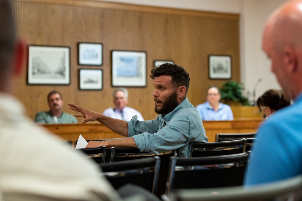 Ward 3 resident Thomas Klepach asks a question of City Manager Mike Roy during the City Council budget meeting Tuesday. Klepach asked questions about the airport budget as well as other line items.