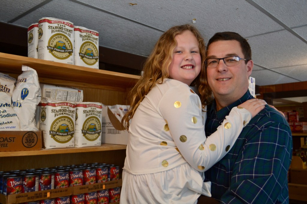 Chris Russell, right, and his daughter Gabby recently toured the Winthrop Food Pantry, a United Way partner program.