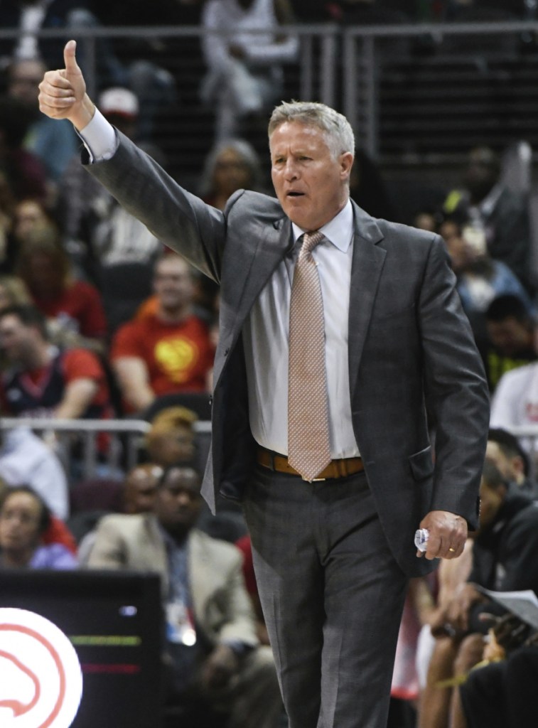 Philadelphia 76ers coach Brett Brown signals players during the second half of a game against the Atlanta Hawks back in April in Atlanta. Brown, a Maine native and son of legendary coach Bob Brown, was given a 3-year extension by the 76ers on Thursday.