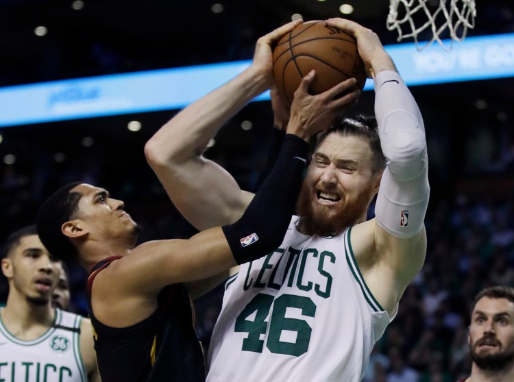 Boston's Aron Baynes battles for a rebound with Cleveland's Jordan Clarkson Wednesday night in Game 5 of the Eastern Conference finals.
