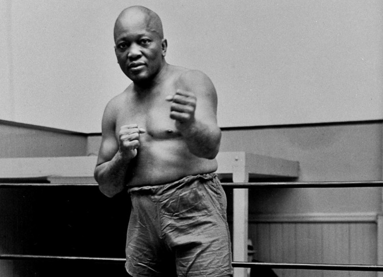 Boxer Jack Johnson, the first black world heavyweight champion, poses for a photo in 1932 in New York City. President Donald Trump on Thursday granted a rare posthumous pardon to boxing's first black heavyweight champion, clearing Jack Johnson’s name more than 100 years after a racially charged conviction.  