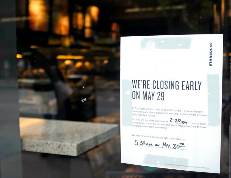 A store closing sign is posted outside of a Starbucks store. Starbucks will close more than 8,000 stores nationwide Tuesday to conduct anti-bias training.   Kiichiro Sato/Associated Press