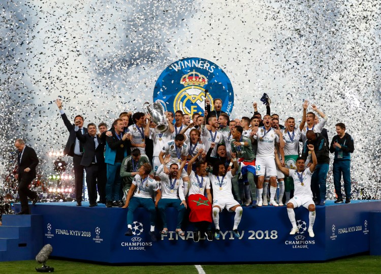 Real Madrid players celebrate with the trophy after winning the Champions League Final soccer match between Real Madrid and Liverpool on Saturday at the Olimpiyskiy Stadium in Kiev, Ukraine.