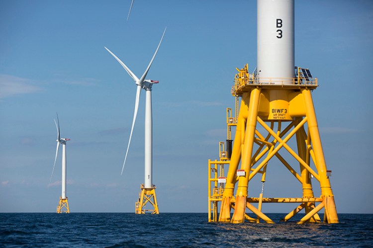 Three of Deepwater Wind's turbines stand in the water off Block Island, R.I. in 2016.