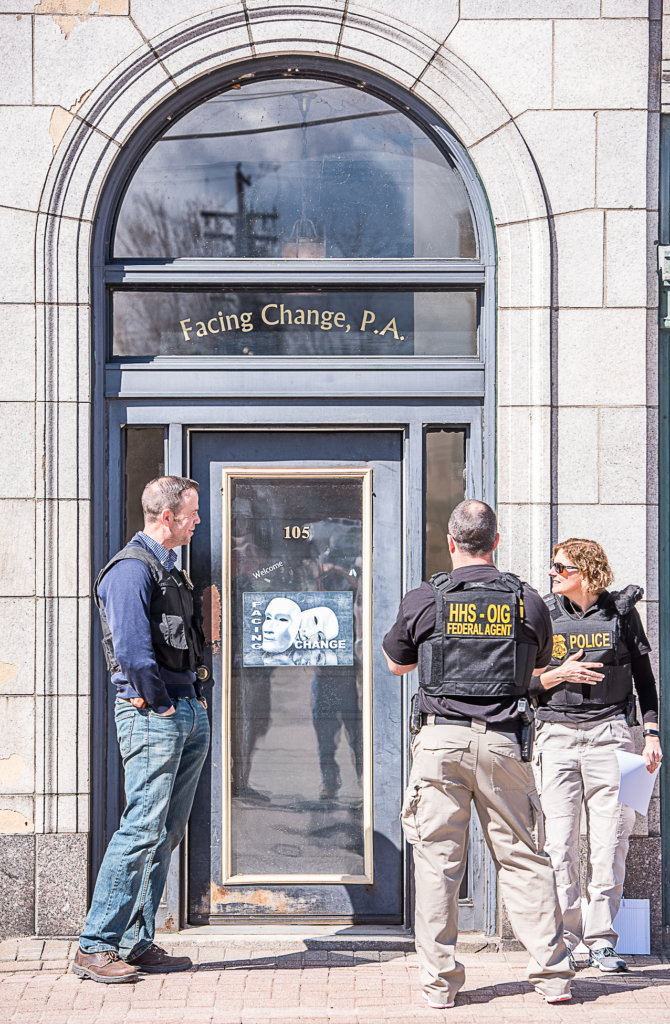 Federal agents assemble outside of the Facing Change office in Lewiston on Tuesday morning. 