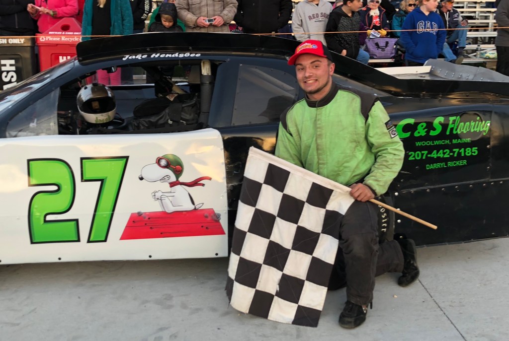 Jake Hendsbee of Whitefield is all smiles after winning the Outlaw Mini feature race at Wiscasset Speedway in Wiscasset on Saturday night.
