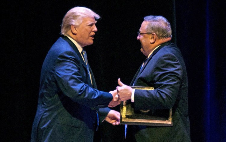 Gov. Paul LePage welcomes Donald Trump to the stage at an Aug. 4, 2016, campaign rally in Portland. 