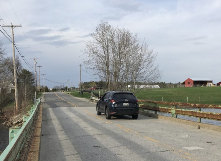 A sport utility vehicle crosses the Burnham Bridge from Litchfield into West Gardiner on Wednesday. The bridge, which is slated for replacement this summer, will be closed starting Monday.
