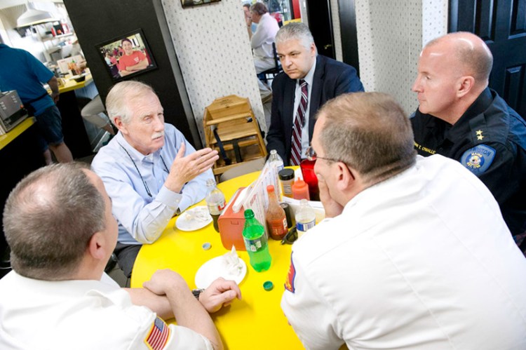 U.S. Sen. Angus King, second from left, has lunch Tuesday with, counterclockwise from lower left: Lewiston Fire Chief Brian Stockdale, Auburn Fire Chief Robert Chase, Lewiston Police Chief Brian O'Malley and Auburn Police Chief Phil Crowell at Simones' Hot Dog Stand in Lewiston. 
