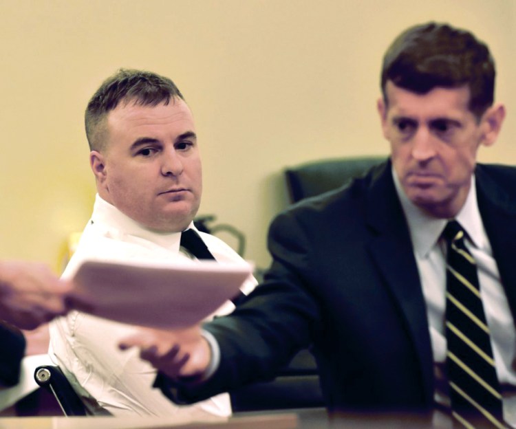 Defendant Jeremy Clement, left, looks on as his attorney, Walter McKee, receives a court document during the first day of his jury trial on charges of attempted murder in Augusta Superior Court on Monday.