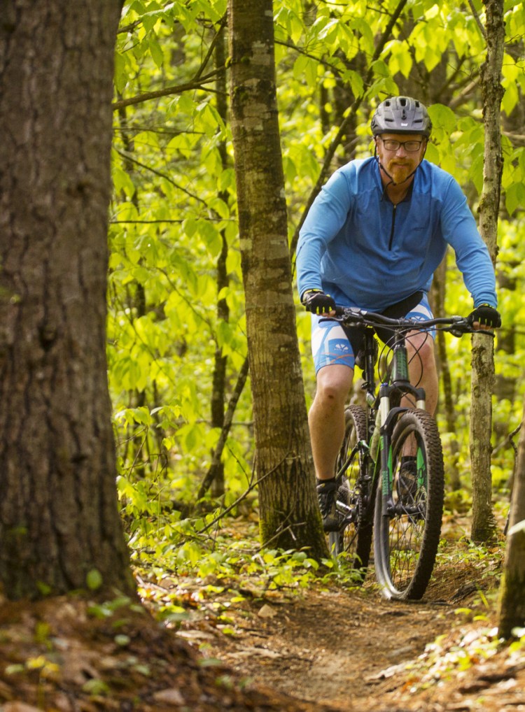 Thor Smith of Lewiston rides the new trails at Range Pond State Park.
