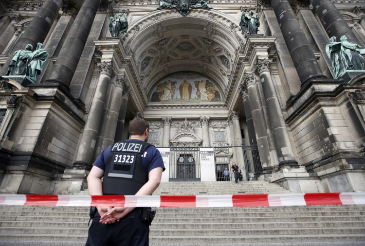 A police officer stands in front of the Berlin Cathedral in Berlin, Germany, on Sunday. 