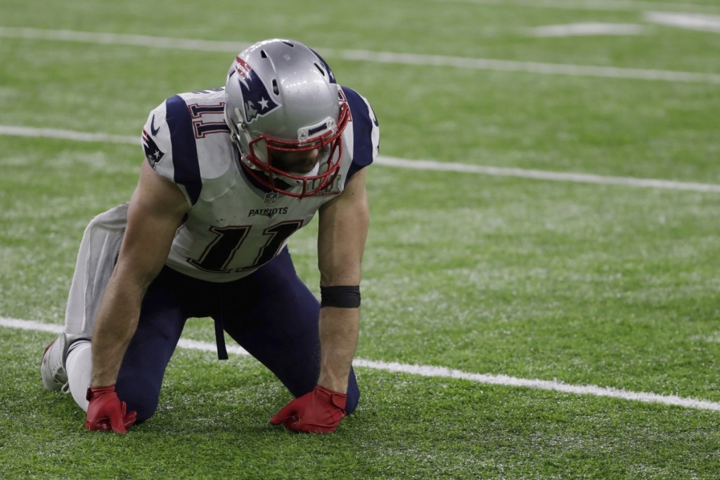 New England Patriots receiver Julian Edelman gets up slowly during the second half of Super Bowl LI on Feb. 5, 2017, in Houston. (AP Photo/Matt Slocum)