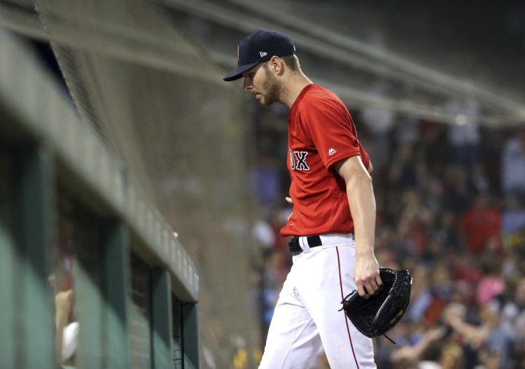 Chris Sale walks to the dugout after pitching eight innings against the Chicago White Sox Friday night at Fenway Park. Sale lost his third straight, giving up a run in the seventh inning.