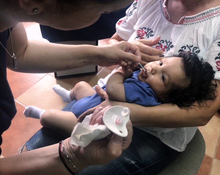 A child gets a dose of vaccine in Chitila, Romania. An outbreak of measles has killed dozens of children in Romania. Doctors say the surge in the disease is aided by low rates of vaccination. 