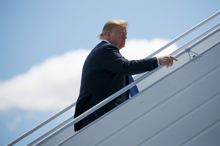 President Trump boards Air Force One for a trip to Singapore to meet with North Korean leader Kim Jong Un at Canadian Forces Base Bagotville.