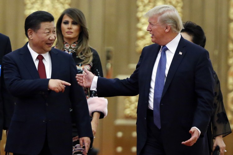 President Trump and China's President Xi Jinping arrive for the state dinner in Beijing, China, in November. The two had dinner Saturday during the Group of 20 summit but gave no indication of any trade breakthroughs. 