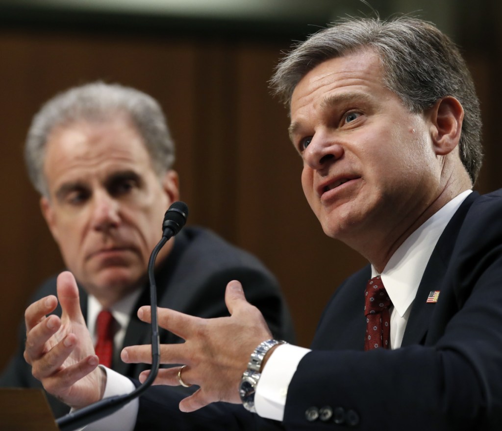 Department of Justice Inspector General Michael Horowitz, left, and FBI Director Christopher Wray testify Monday during a hearing of the Senate Judiciary Committee.