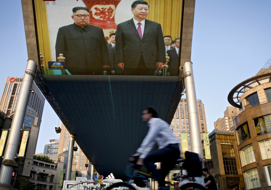 A TV screen broadcasts the opening Tuesday of two days of talks between North Korean leader Kim Jong Un, left, and Chinese President Xi Jinping. Kim is likely hoping to get China's support for relief from punishing U.N. sanctions imposed in an effort to persuade the North to back off on its nuclear ambitions.
Associated Press/
Andy Wong
