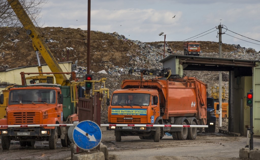 Garbage trucks leave the Volovichi landfill near the town of Kolomna, south of Moscow, after depositing their loads. Residents are blaming rotting trash from Moscow for respiratory problems and skin rashes that they say are caused by foul air and poisonous gases.