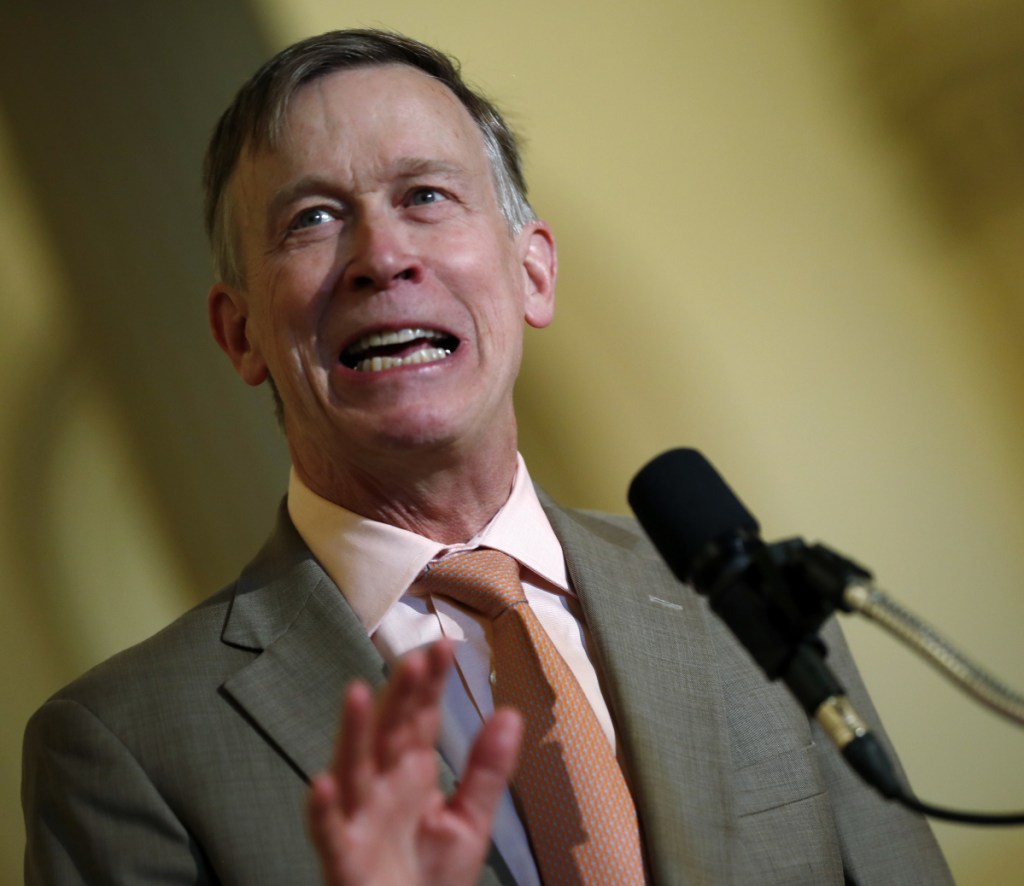 Colorado Gov. John Hickenlooper speaks at the state Capitol in May. On Tuesday, Hickenlooper ordered state regulators to adopt California's vehicle pollution rules, joining other states in resisting the Trump administration's plans to ease up on emissions standards.