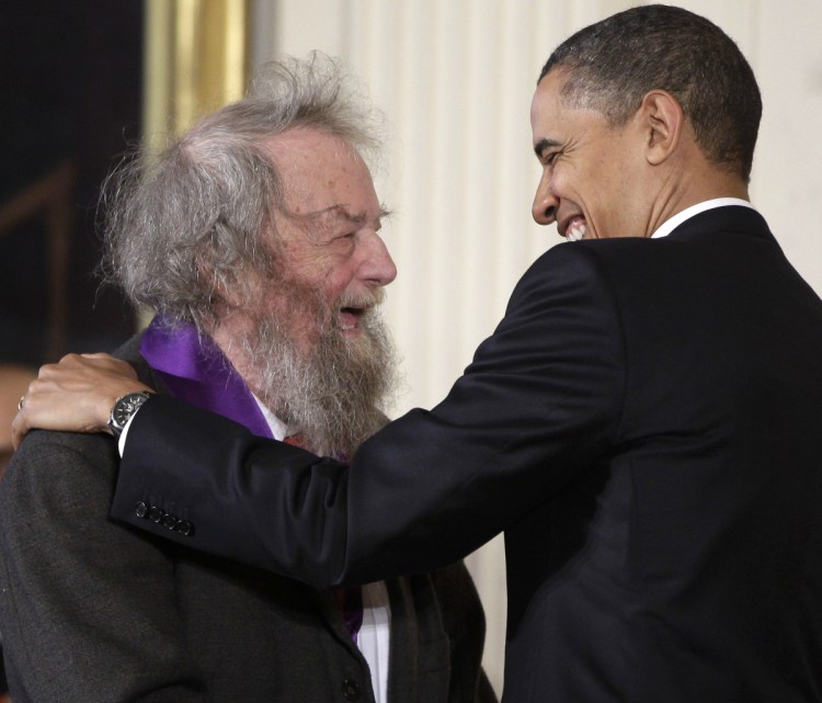 President Obama presents a 2010 National Medal of Arts to poet Donald Hall in 2011, during a ceremony in the East Room of the White House in Washington.